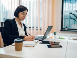 Business working on a laptop in a creative office environment