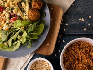 Overhead view of fresh italian meal served in bowl on wooden table