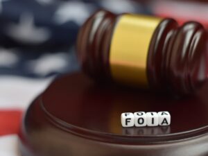 Justice mallet and FOIA acronym close up. Freedom of information act