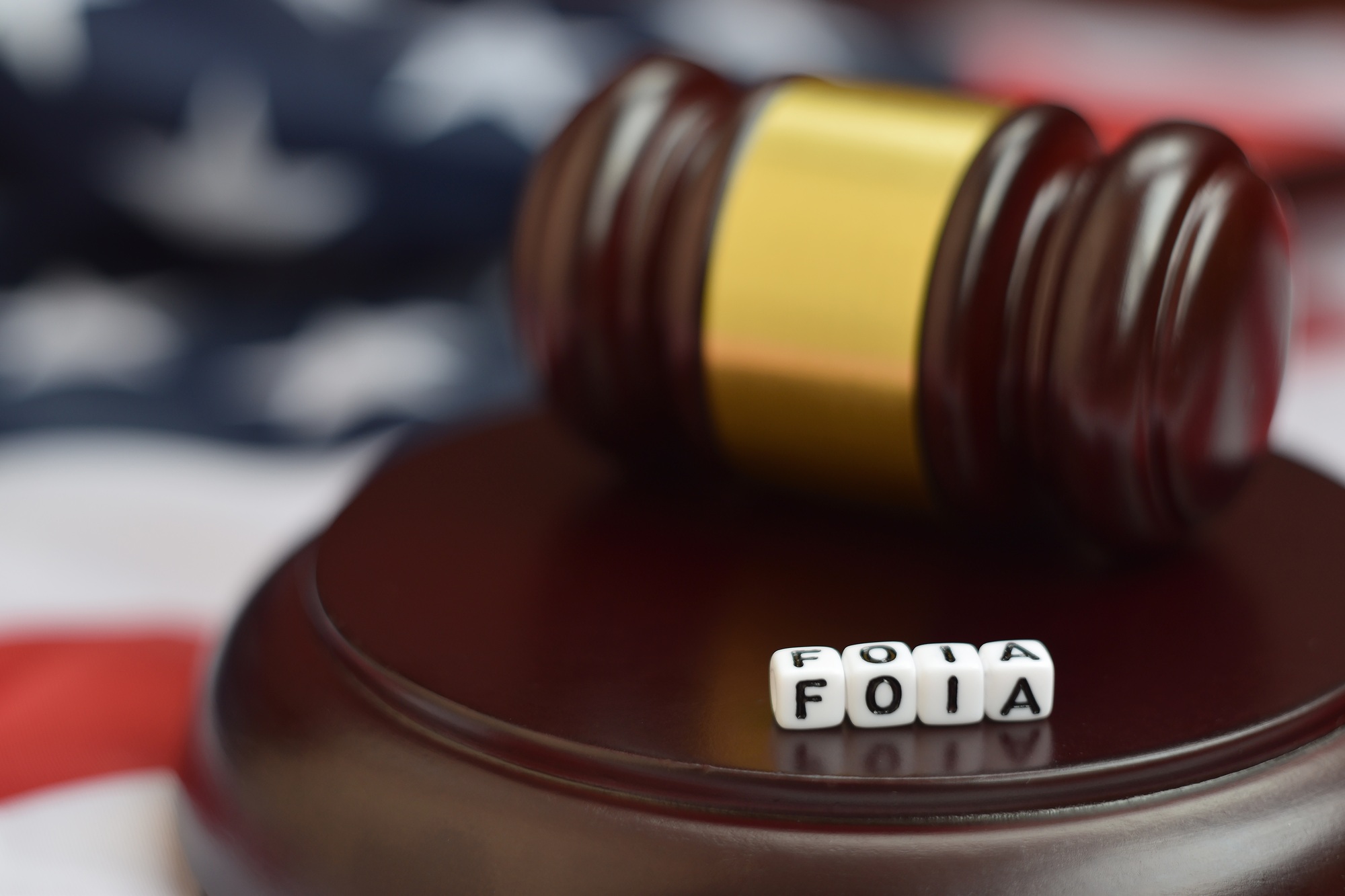 Justice mallet and FOIA acronym close up. Freedom of information act