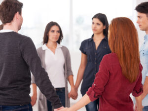 Trust circle. Group of people standing in circle and holding hands